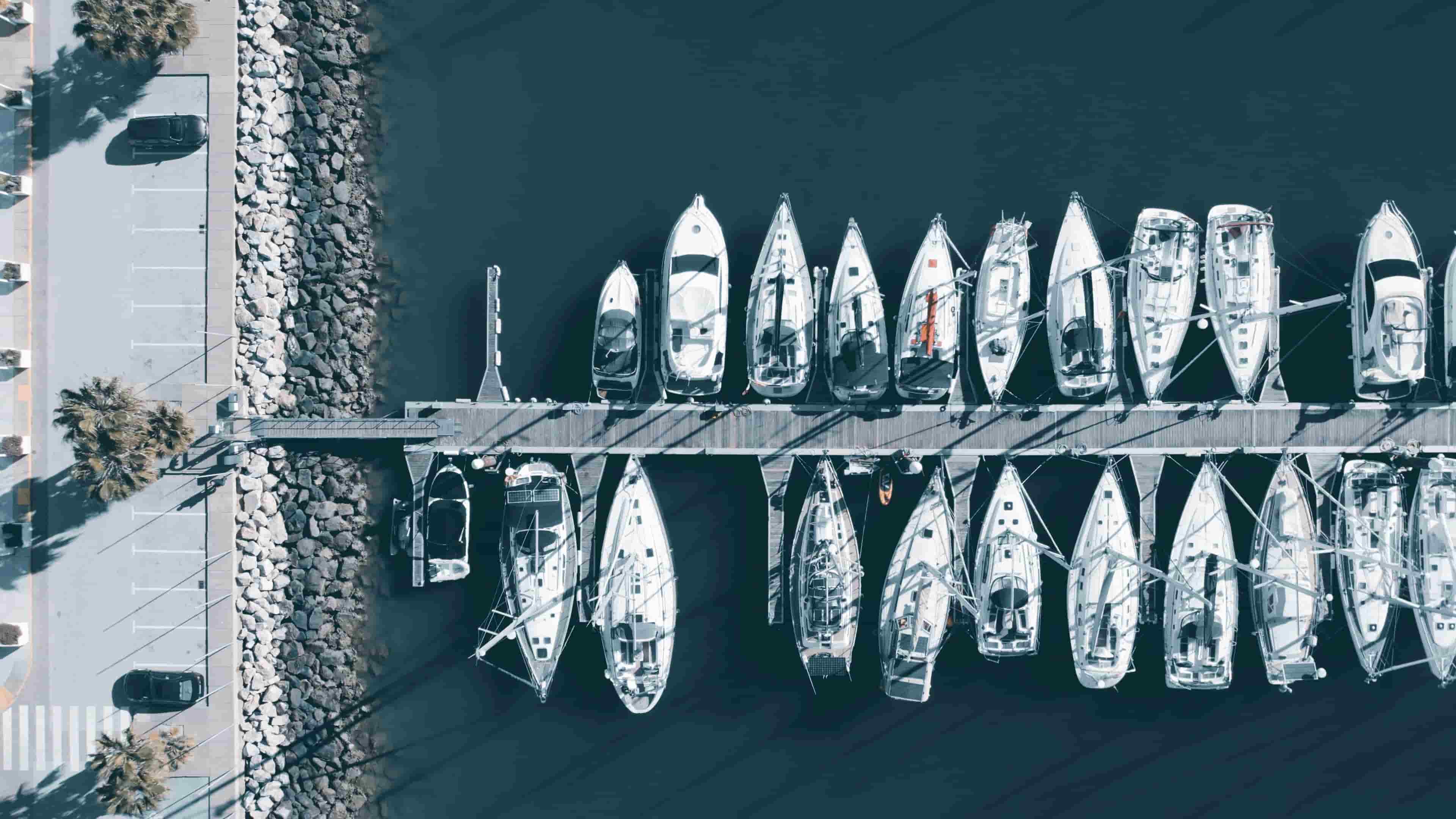 Aerial view of sailboats docked in a marina